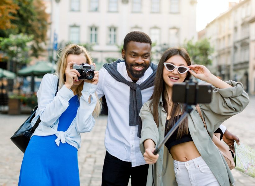 young-traveling-people-having-fun-and-sightseeing-in-city-multiethnic-friends-posing-together.jpg
